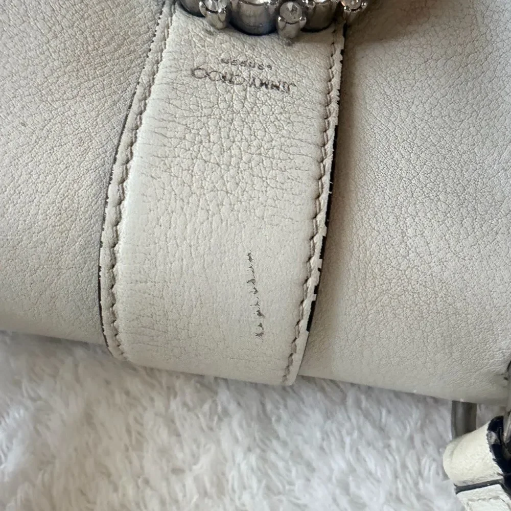 Jimmy Choo signs wear